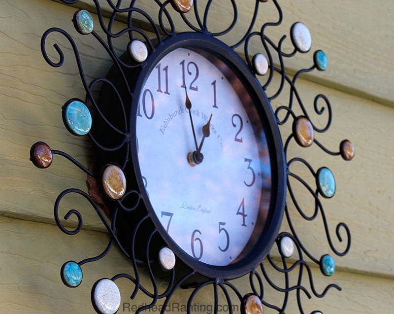 wrought iron clock with colored stones