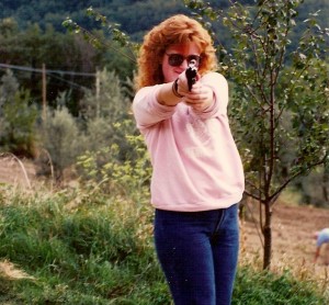 redhead with a gun, redhead woman pointing a gun