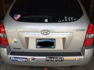 car with Reagan Bumper Sticker, Hyundai with conflicting bumper stickers, conflicting bumper stickers